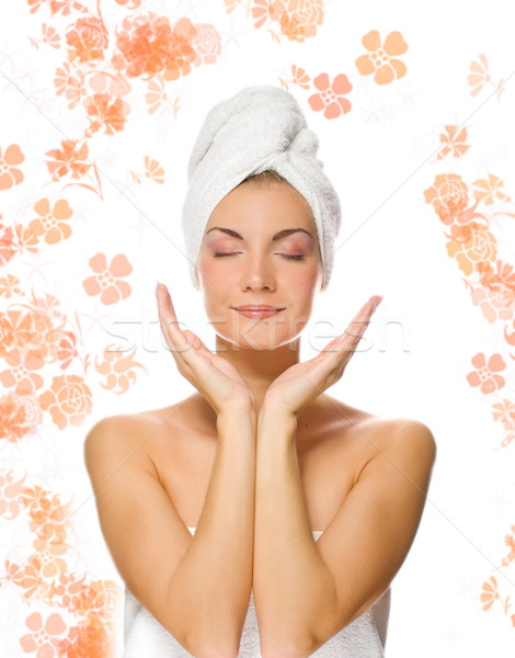 Young lovely lady applying moisturizer to her face after shower Stock photo © Nejron