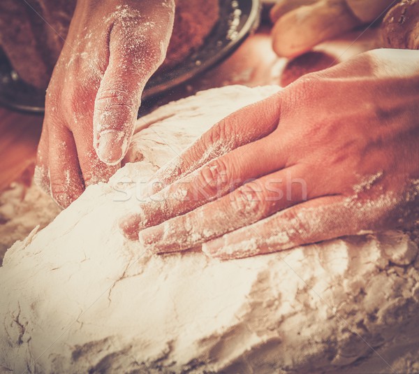 Cook hands preparing dough for homemade pastry Stock photo © Nejron