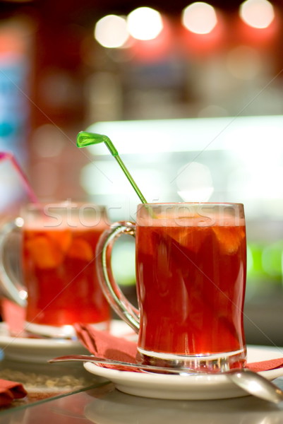 Cup of fruit tea on abstract blurred background (shallow DoF) Stock photo © Nejron