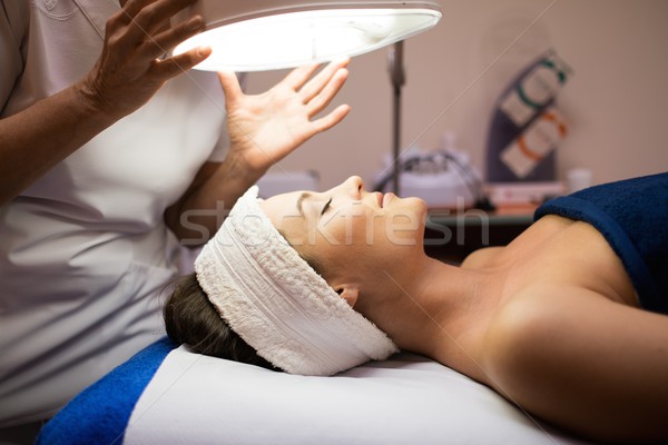 Young woman having facial treatment  Stock photo © Nejron