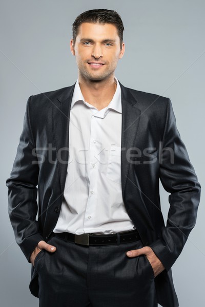 Well-dressed handsome man in black suit and white shirt Stock photo © Nejron