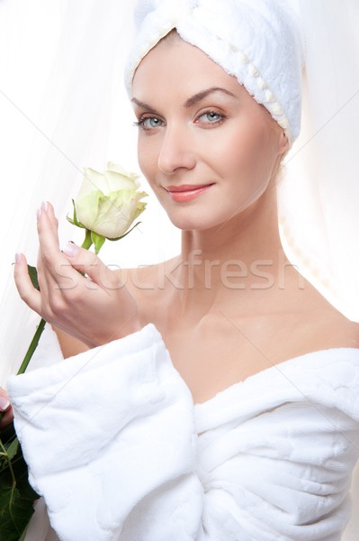Beautiful woman after shower holding a white rose. Stock photo © Nejron