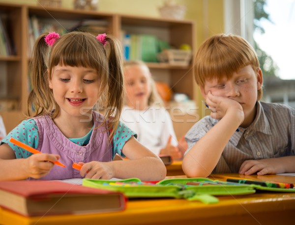 Little girl in a school with sleepy redhead classmate  Stock photo © Nejron