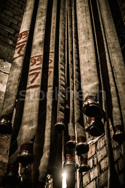 Storage room in firefighting depot with water hoses  Stock photo © Nejron