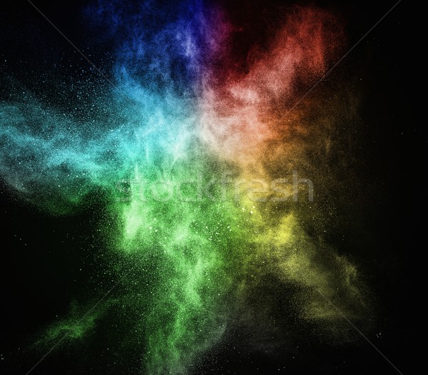 Colourful powder exploding isolated on black Stock photo © Nejron