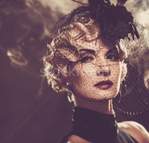 Elegant blond retro woman in veil with beautiful hairdo  Stock photo © Nejron