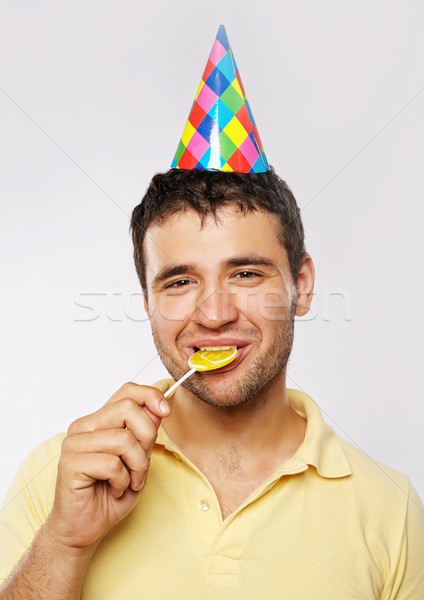 Funny man with a lollipop. Stock photo © Nejron