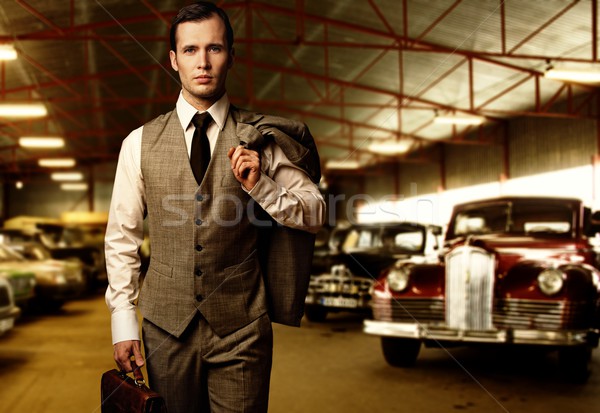 Businessman with a briefcase in garage Stock photo © Nejron