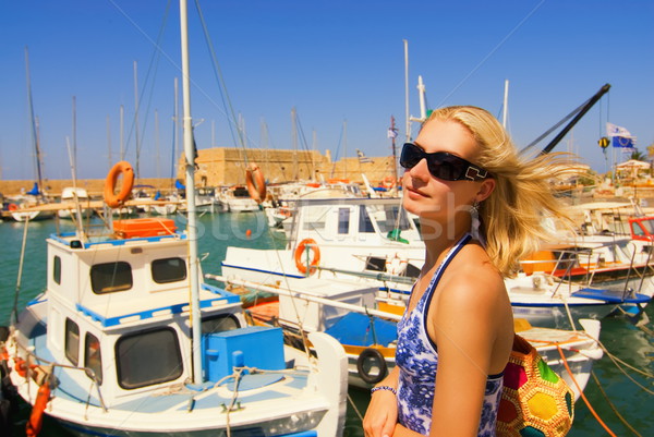 Beautiful blond girl in sunglasses near the yacht club Stock photo © Nejron
