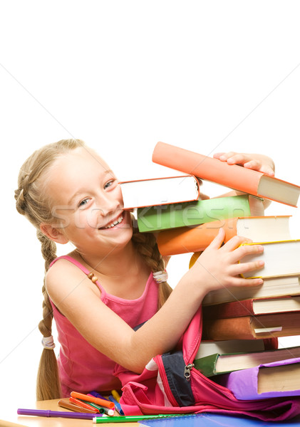 Little schoolgirl packing her rucksack 

 Stock photo © Nejron