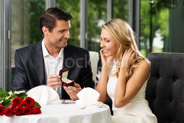 Man holding box with ring making propose to his girlfriend Stock photo © Nejron
