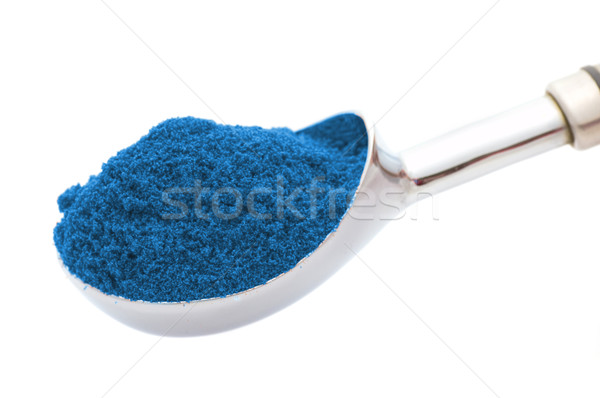 Silver spoon with blue powder isolated on white Stock photo © Nejron