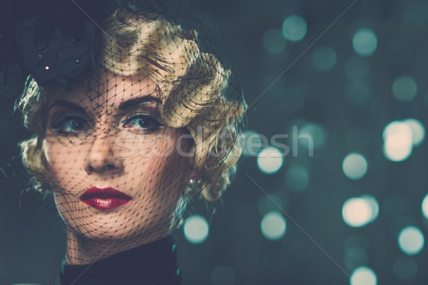 Stock photo: Elegant blond retro woman   wearing little hat with veil 