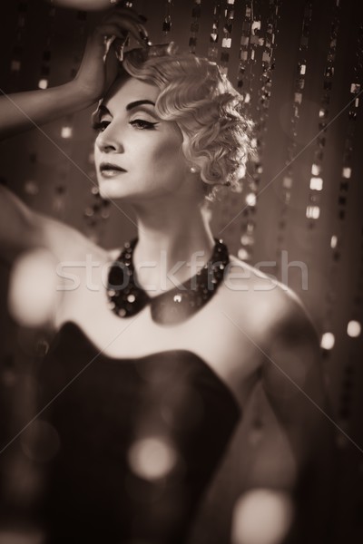 Elegant blond retro woman with beautiful hairdo  Stock photo © Nejron
