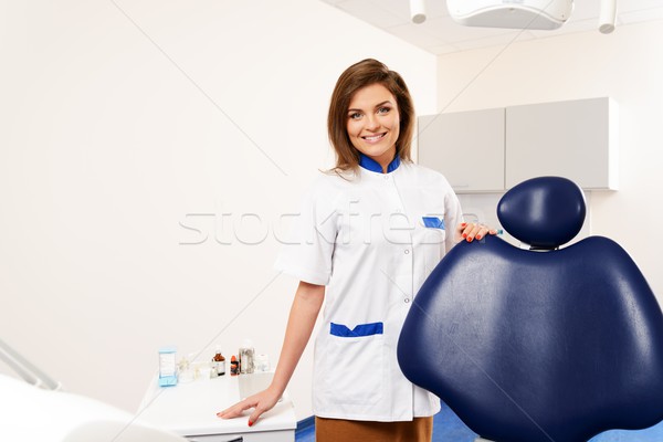 Young beautiful brunette woman dentist at dentist's surgery  Stock photo © Nejron