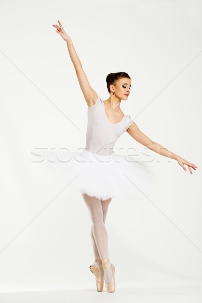 Young ballerina dancer in tutu showing her techniques  Stock photo © Nejron