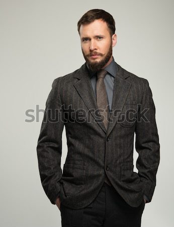 Handsome well-dressed man in jacket over his shoulder Stock photo © Nejron