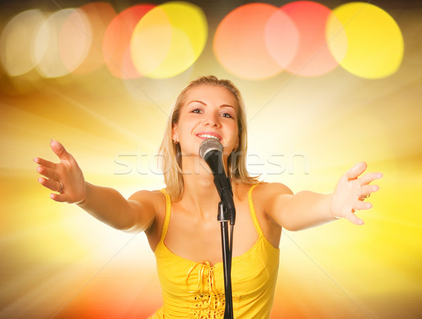 Beautiful young singer on abstract background Stock photo © Nejron