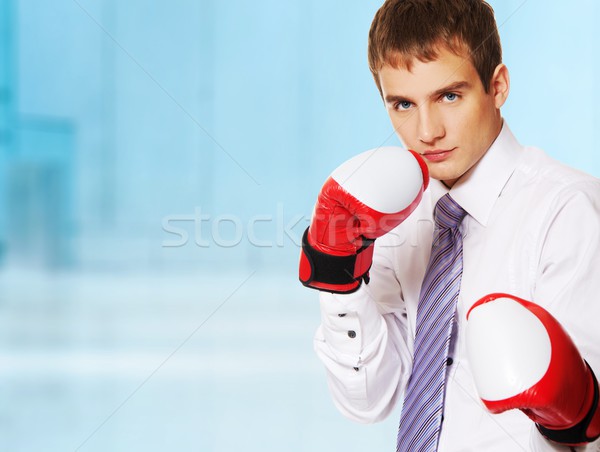 Young businessman with boxing gloves Stock photo © Nejron