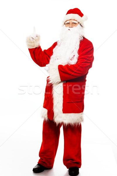 Stock photo: Santa Claus showing with gestures something isolated on white background 