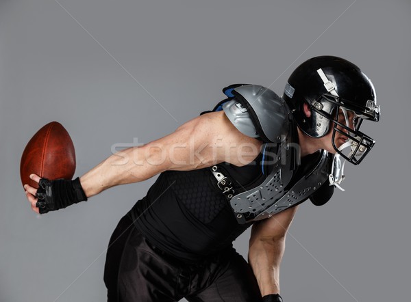 Amerikai futballista labda visel sisak páncél Stock fotó © Nejron