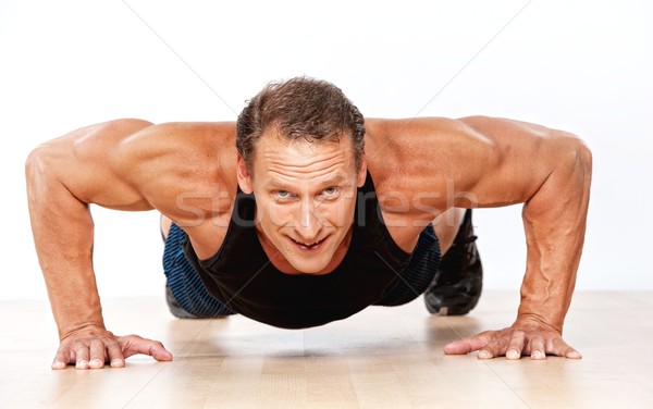 Jóképű izmos férfi fitnessz dolgozik izom Stock fotó © Nejron