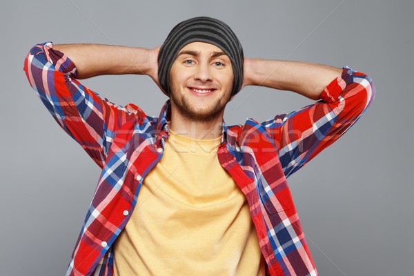 Stylish young man in shirt and beanie hat Stock photo © Nejron