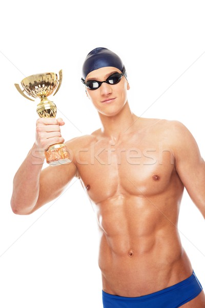 Young athletic man with cup prize in swimming cap and googles  Stock photo © Nejron