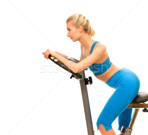 Stok fotoğraf: Güzel · genç · kadın · egzersiz · bisiklet · beyaz · gülümseme