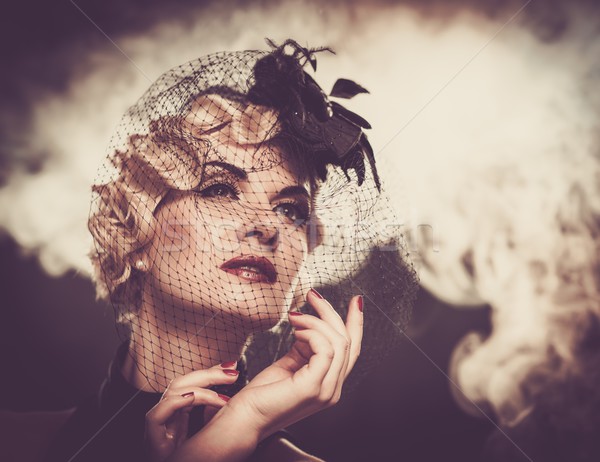 Elegant blond retro woman in veil with beautiful hairdo  Stock photo © Nejron