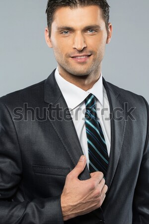 Przystojny mężczyzna czarny garnitur tie działalności uśmiech model Zdjęcia stock © Nejron