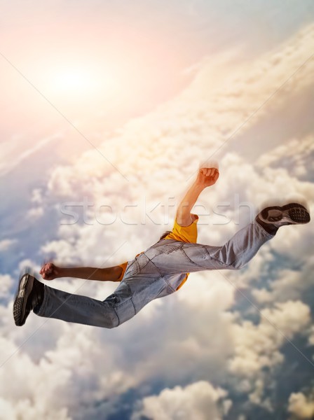 Uçan adam gün batımı arka plan mavi atlamak Stok fotoğraf © Nejron