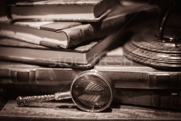 Loupe near vintage books Stock photo © Nejron