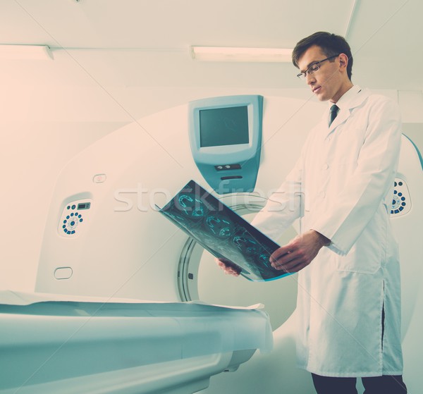 Stock photo: Doctor looking at the computed tomography results