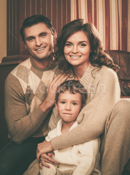 Family in warm cashmere clothes in home interior  Stock photo © Nejron