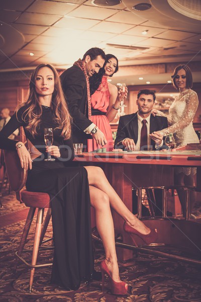 Group of stylish people playing in a casino Stock photo © Nejron