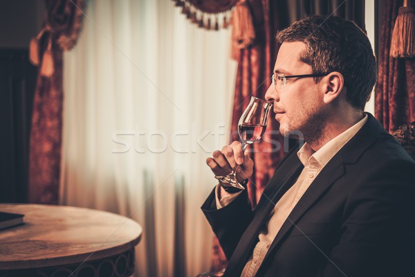 Middle-aged tasting cognac in luxury vintage style interior  Stock photo © Nejron