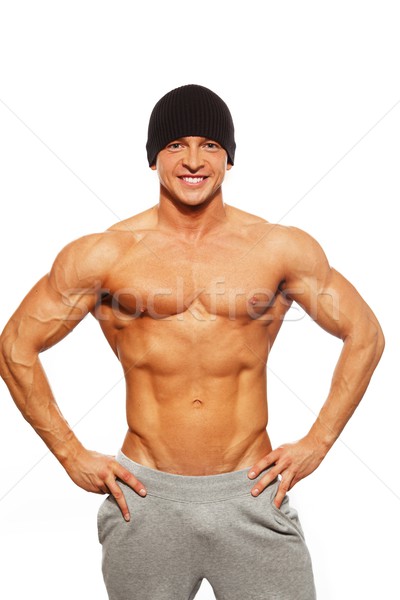 Handsome man with muscular torso in beanie hat posing  Stock photo © Nejron