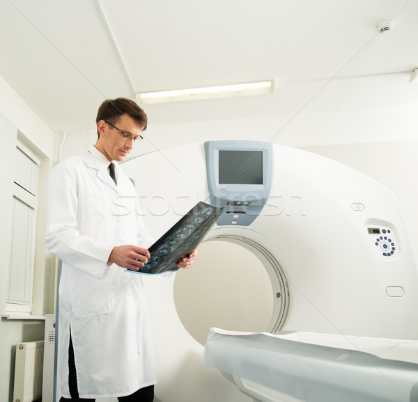 Doctor looking at the computed tomography results Stock photo © Nejron