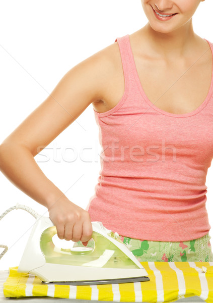 Beutiful woman ironing clothes. Isolated on white background Stock photo © Nejron