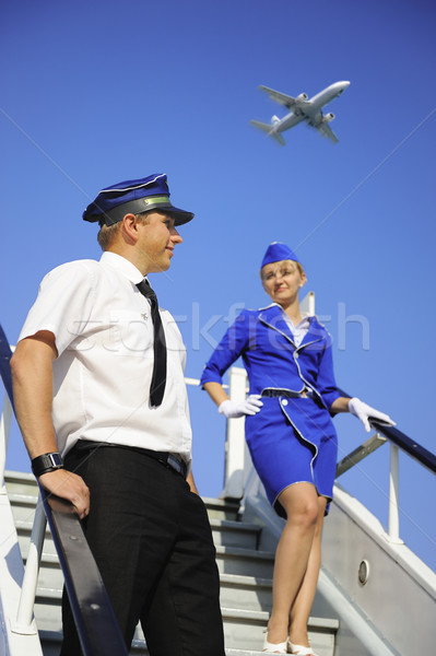 Kép légiutas-kísérők pár férfiak kék repülőgép Stock fotó © Nejron