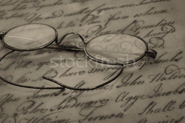 Old glasses on the vintage document Stock photo © Nejron