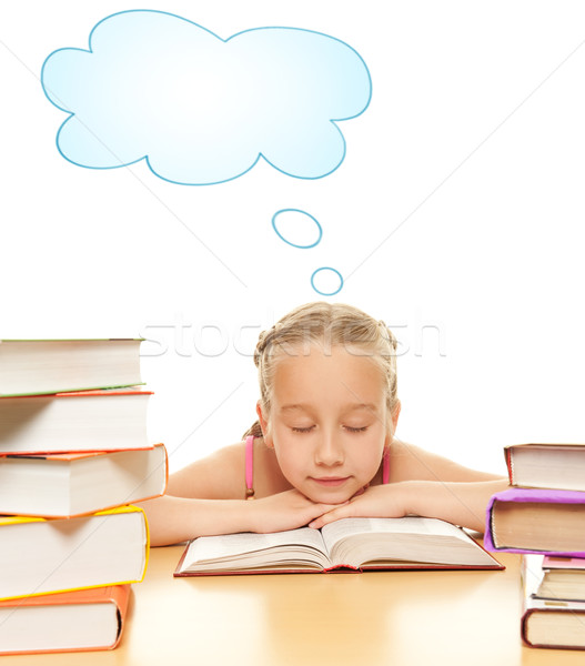 Stock photo: Little schoolgirl fall asleep after reading a book

