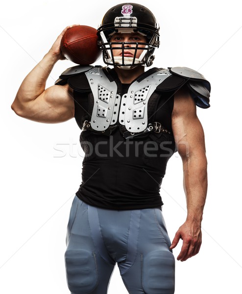 Stock photo: American football player with ball wearing helmet and protective shields 