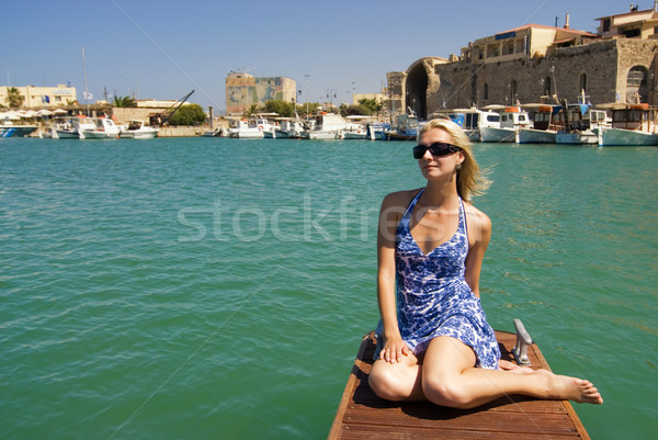 Beautiful blond girl near the yacht in old city Stock photo © Nejron