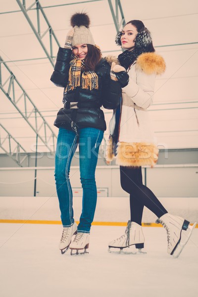 Two girls on ice-skating rink  Stock photo © Nejron