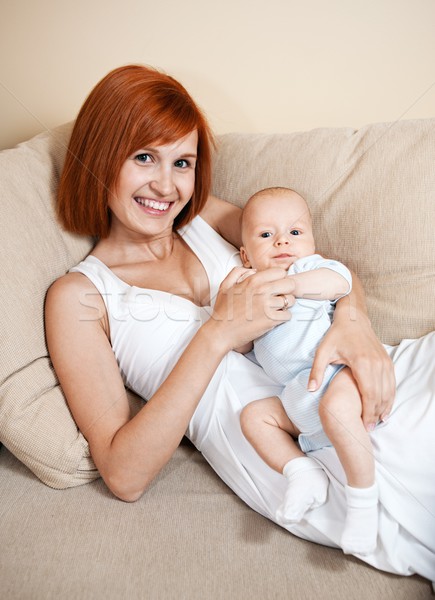 Happy mother with her baby at home. Stock photo © Nejron