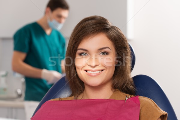 Man dentist reading woman patient's card Stock photo © Nejron