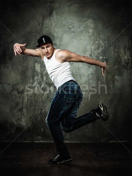 Man dancer showing break-dancing moves Stock photo © Nejron