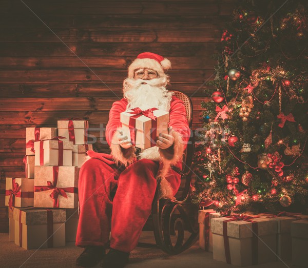 Noel baba oturma ahşap ev iç Stok fotoğraf © Nejron